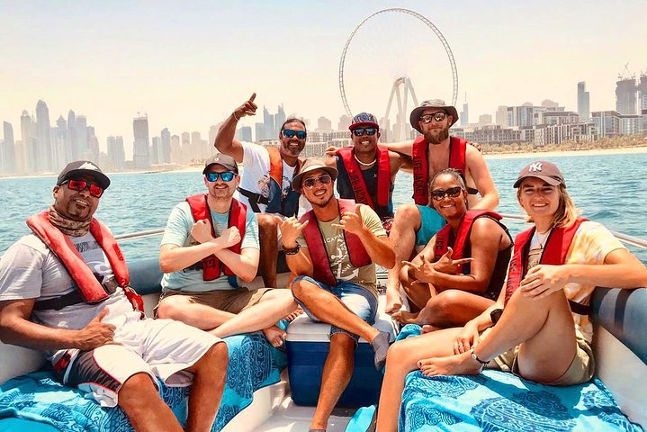 Experience the thrill of fishing in Dubai's stunning waters surrounded by friends and the iconic skyline making unforgettable memories while catching a variety of local fish.
